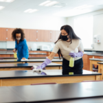 A girl cleaning the table