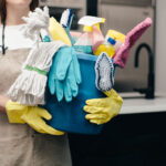 holding-bucket-of-cleaning-supplies